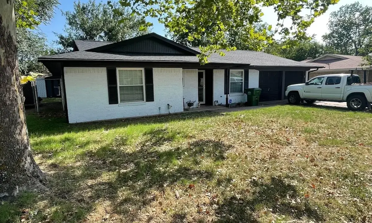 Professional roofing crew working on a residential roof in Pataskala